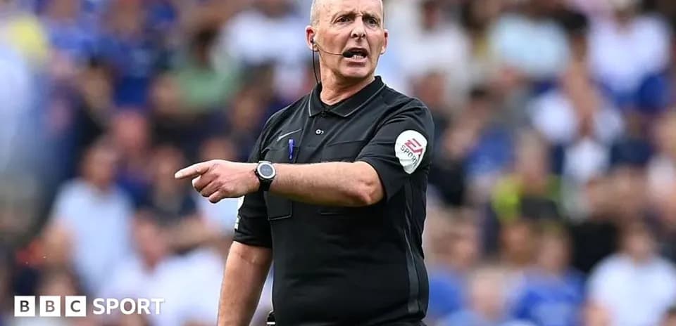 Referee signaling during a football match