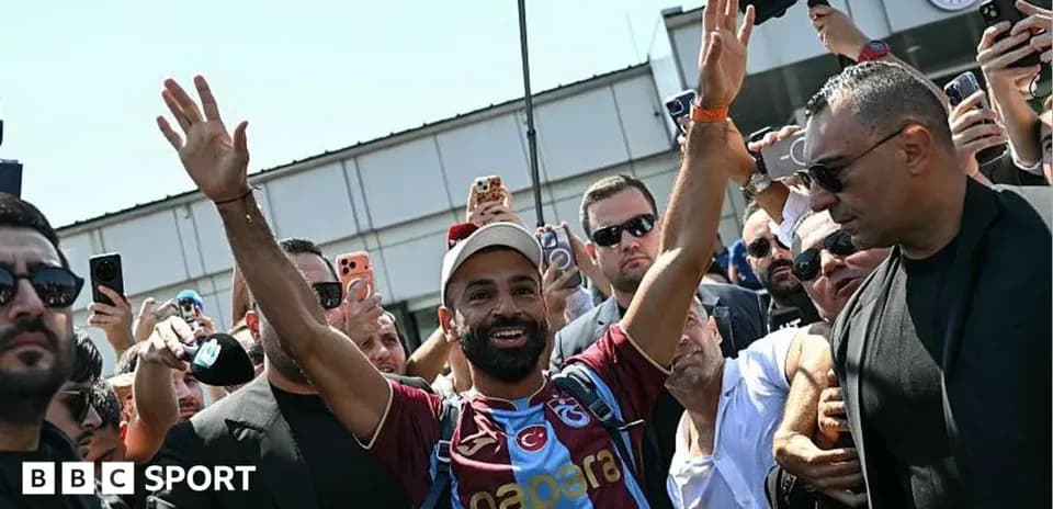 Player greeting fans during arrival at stadium