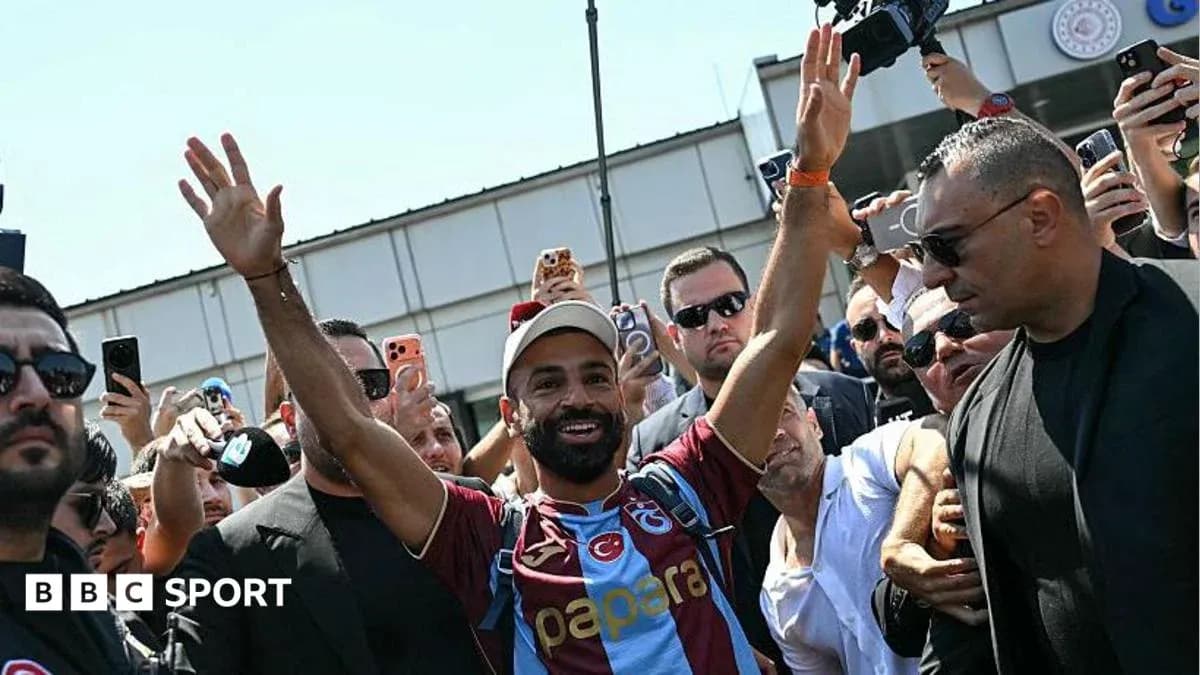 Player greeting fans during arrival at stadium