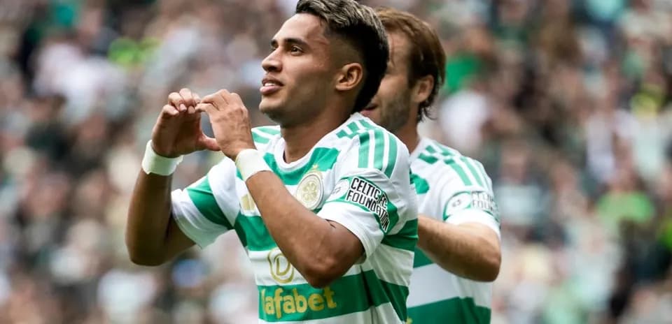 Player celebrating a goal with heart gesture