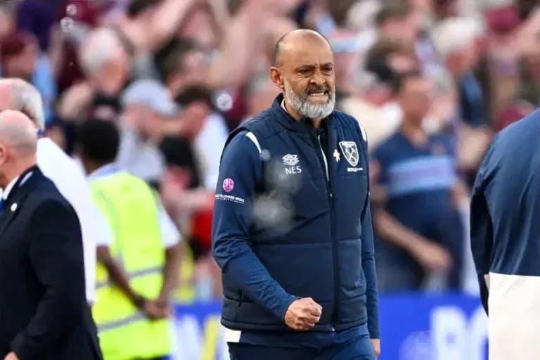 Manager celebrating during a match with fans