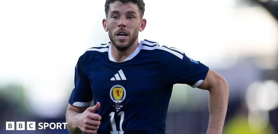 Scottish player running on the field during match