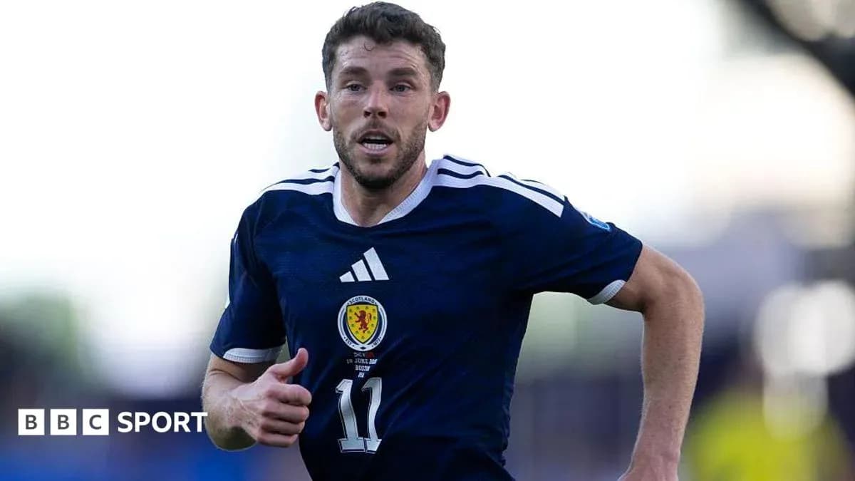 Scottish player running on the field during match