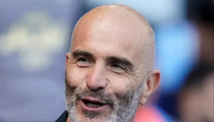 Smiling coach during a match day event