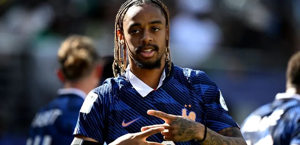 Player gesturing during warm-up in France jersey