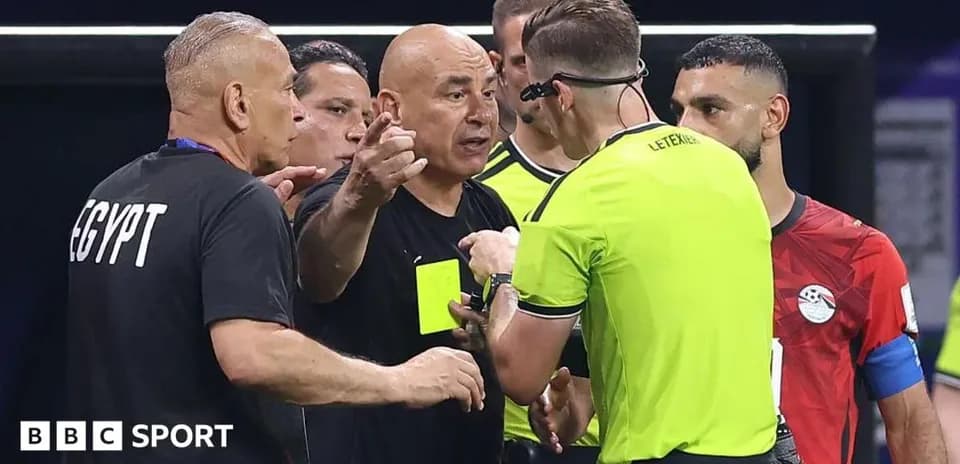 Coach discussing decisions with referee during match