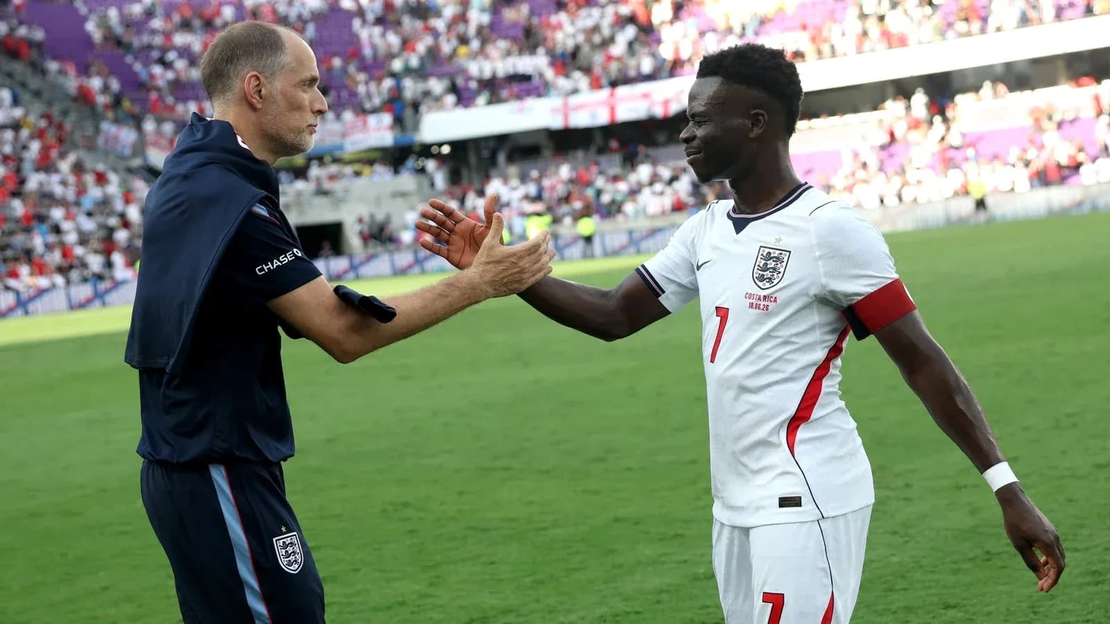 Coach and player shaking hands after match