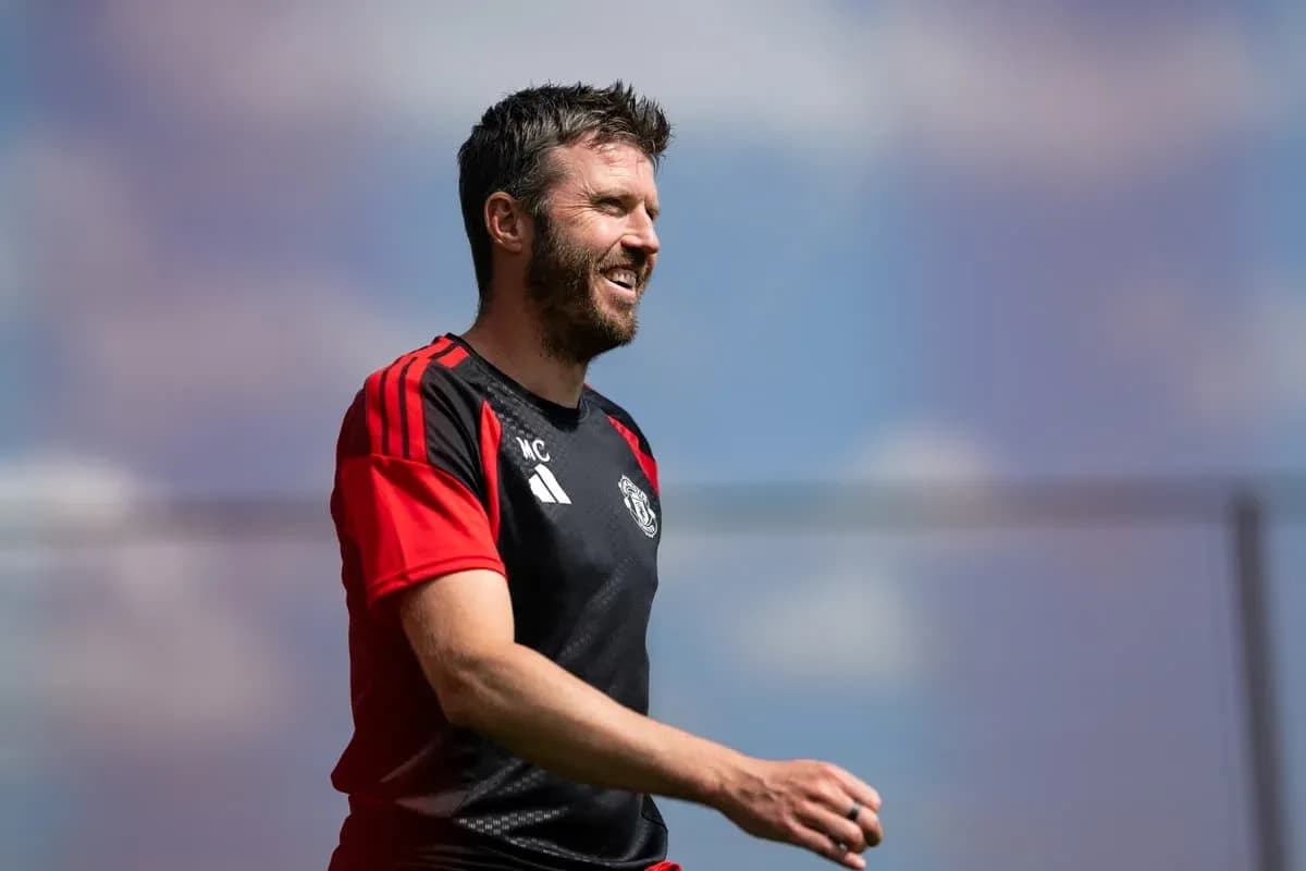 Coach smiling during training session at Manchester United