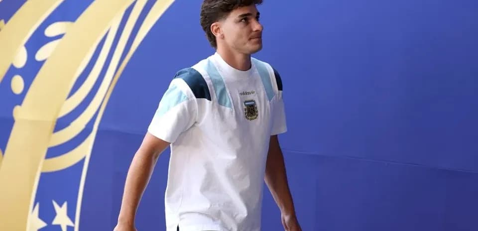 Player walking through entrance with team jersey