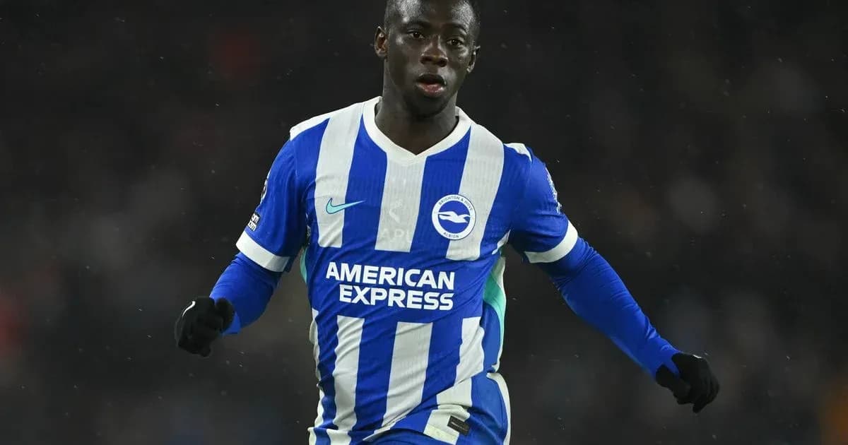 Player celebrating in Brighton home kit during match