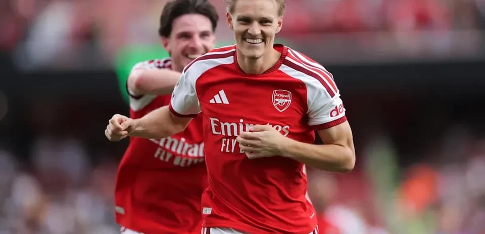 Arsenal players celebrating a goal during a match