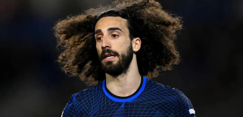 Player with curly hair wearing Chelsea jersey