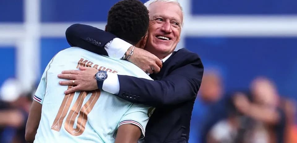 Player and coach embracing after a match