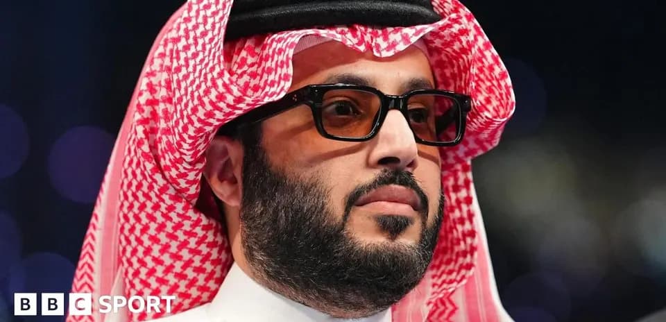 Man in traditional attire with sunglasses at event
