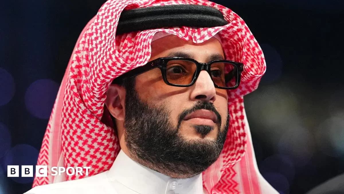 Man in traditional attire with sunglasses at event