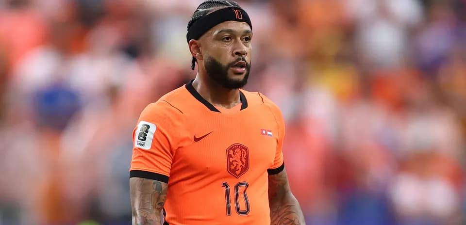 Player in orange jersey during match action