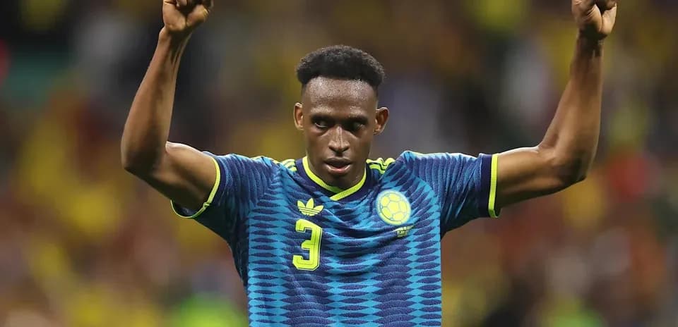 Player celebrating with raised fists on the field
