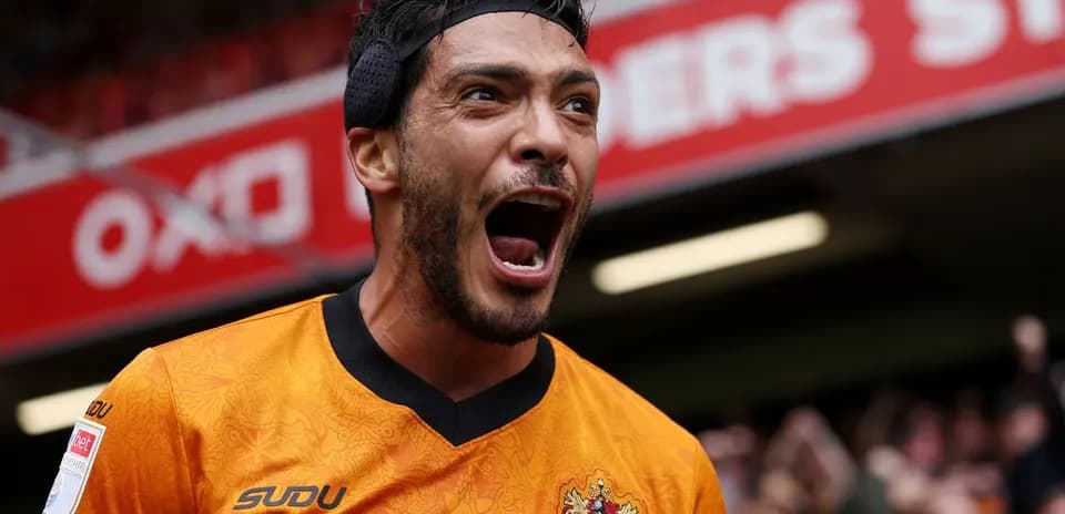 Player celebrating passionately in team jersey
