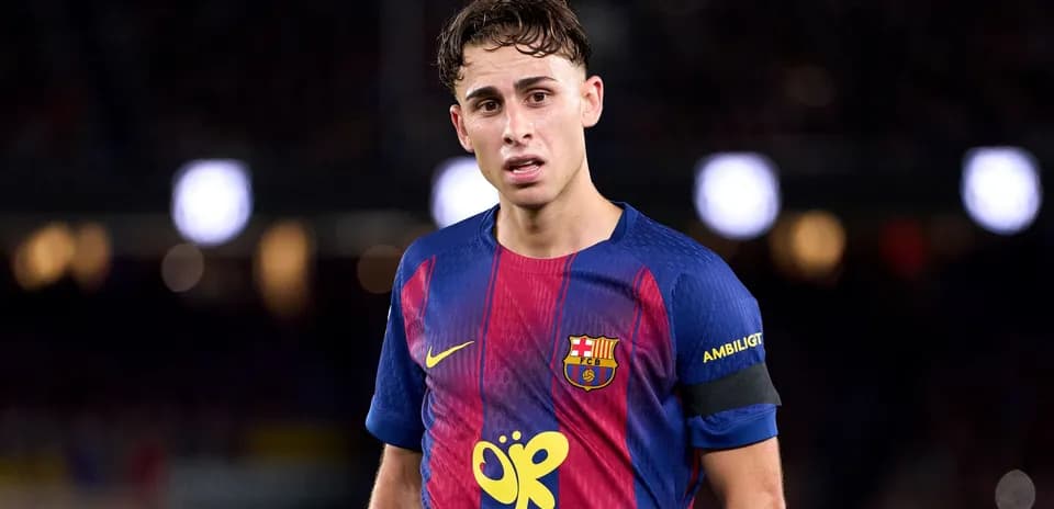 Player wearing FC Barcelona jersey on the pitch