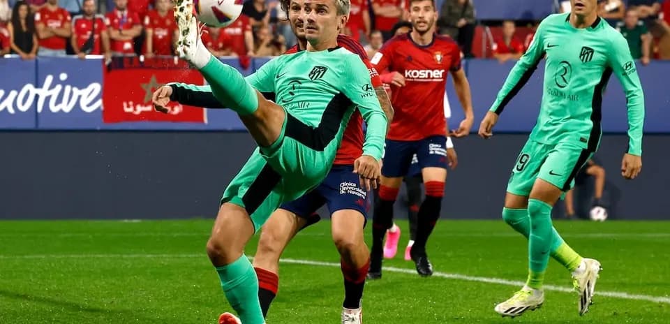 Atletico Madrid player attempting a kick