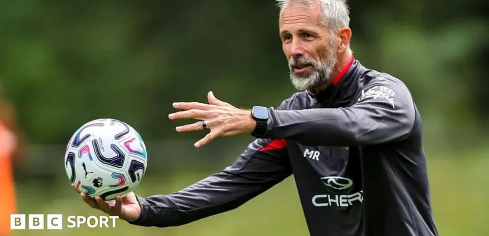 Coach demonstrating a drill with a soccer ball