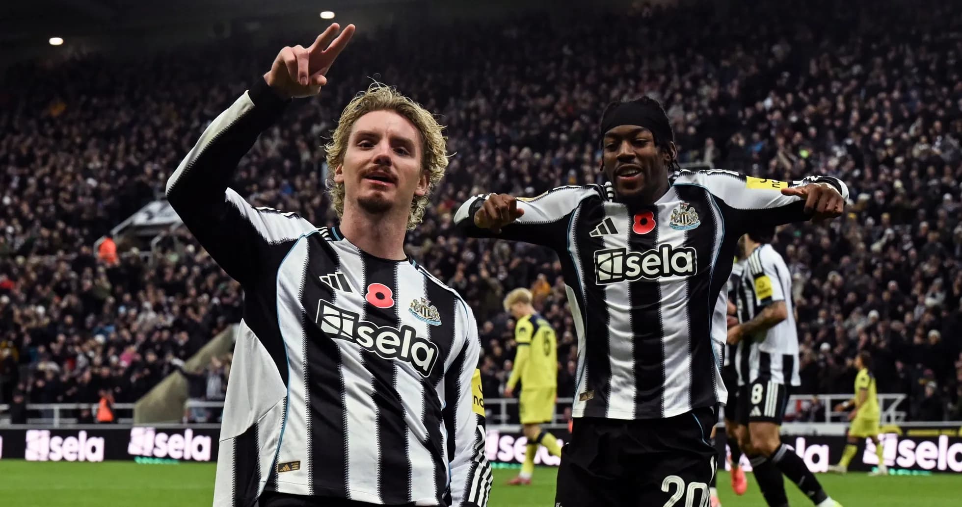 Newcastle players celebrating a goal during match