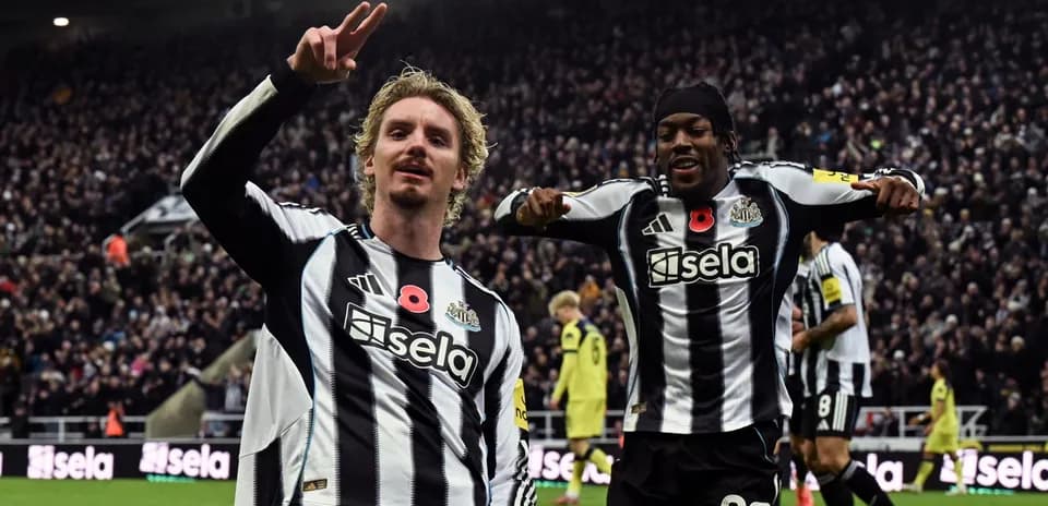 Newcastle players celebrating a goal during match