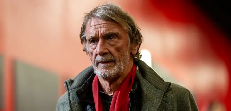 Man with gray hair and scarf in corridor