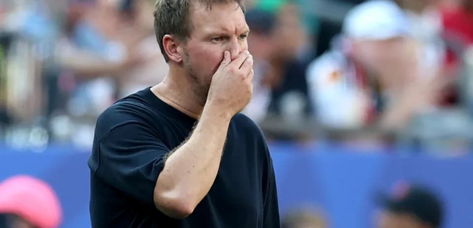 Coach looking concerned during a match