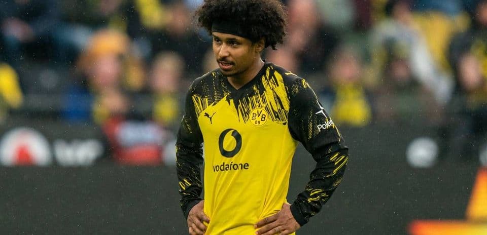 Player wearing Borussia Dortmund kit on field