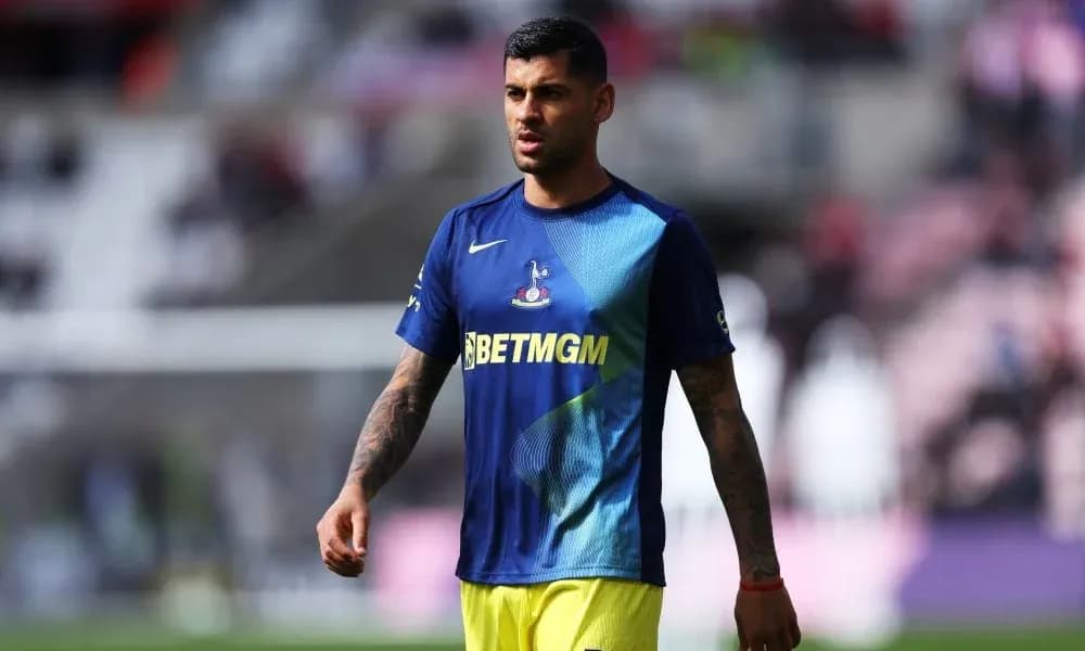 Player walking on the pitch in warm-up attire