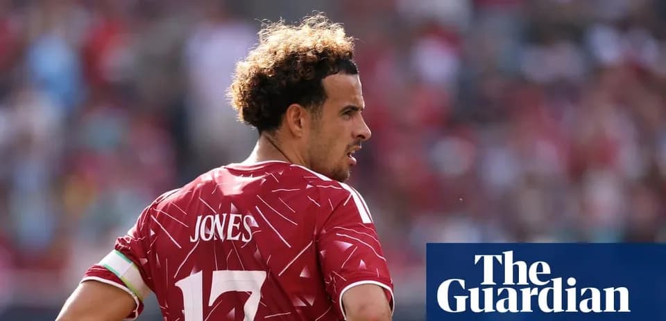 Player in red jersey with 'Jones' on back