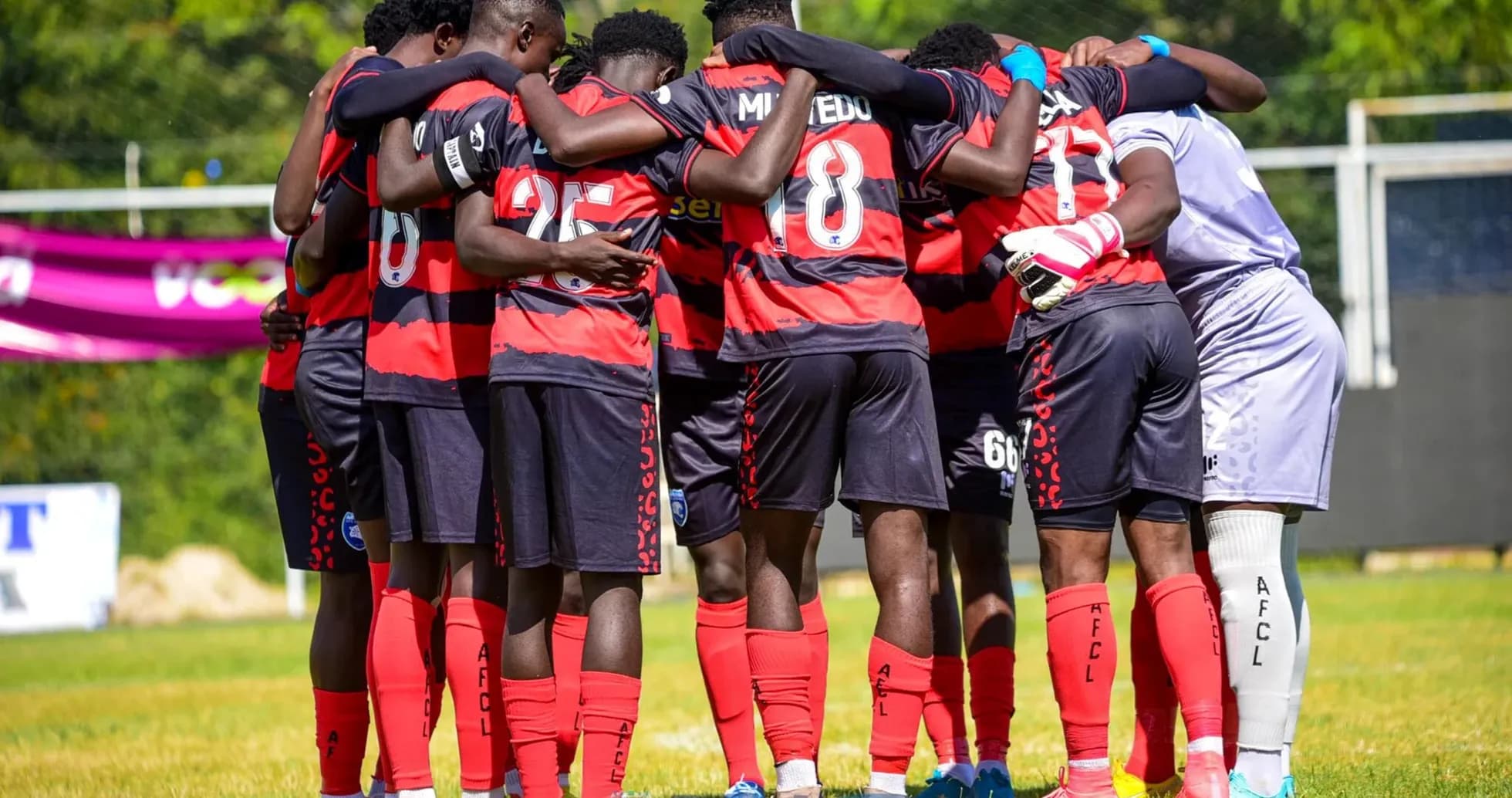 AFCL players in huddle before match