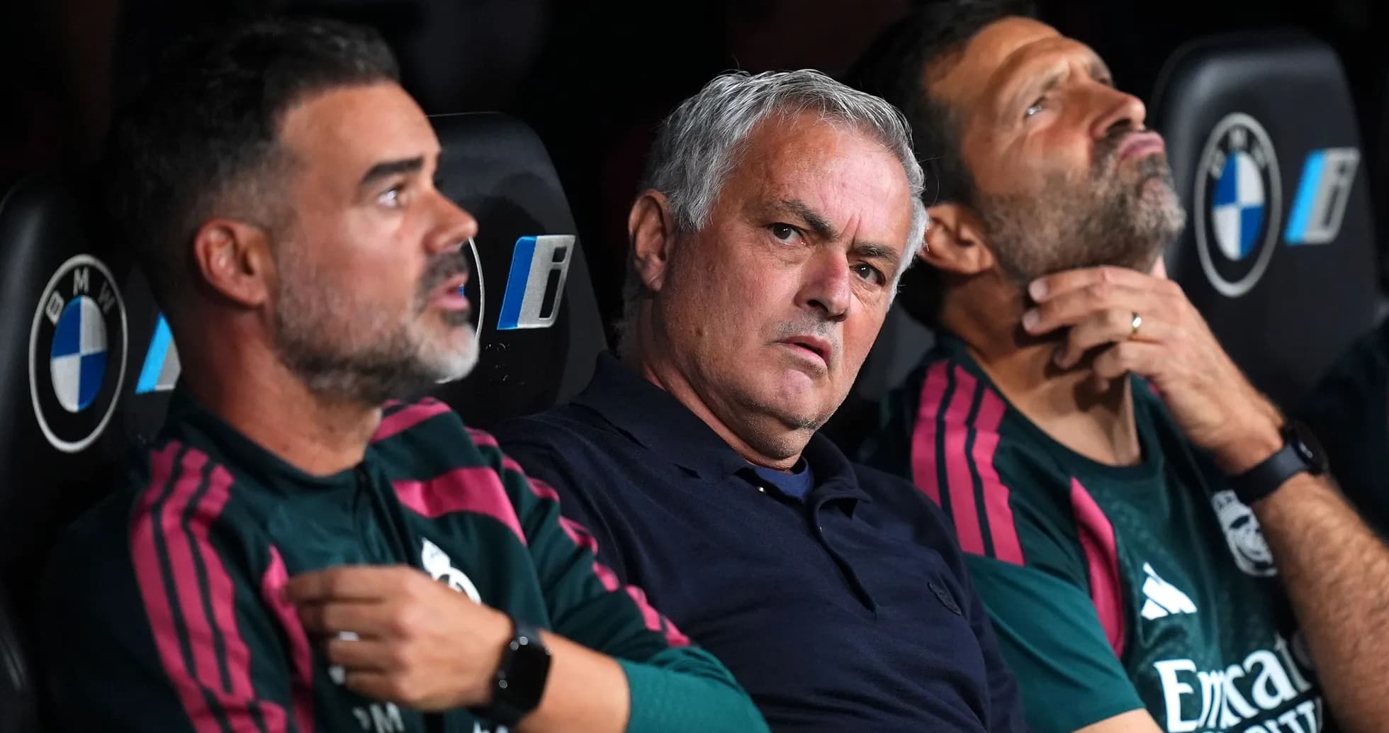 Coaches sitting on the bench during a match