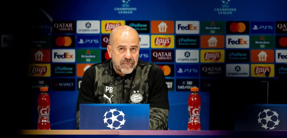 Coach at UEFA Champions League press conference podium