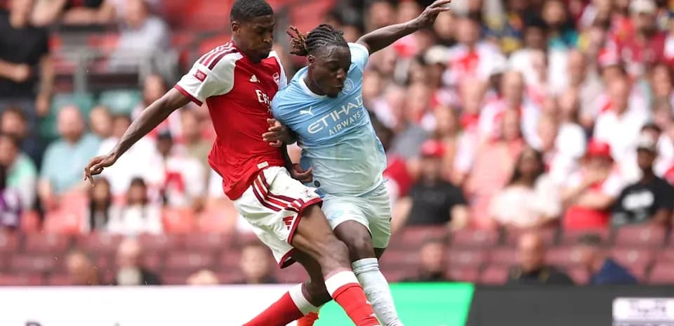 Two players contesting the ball during a match