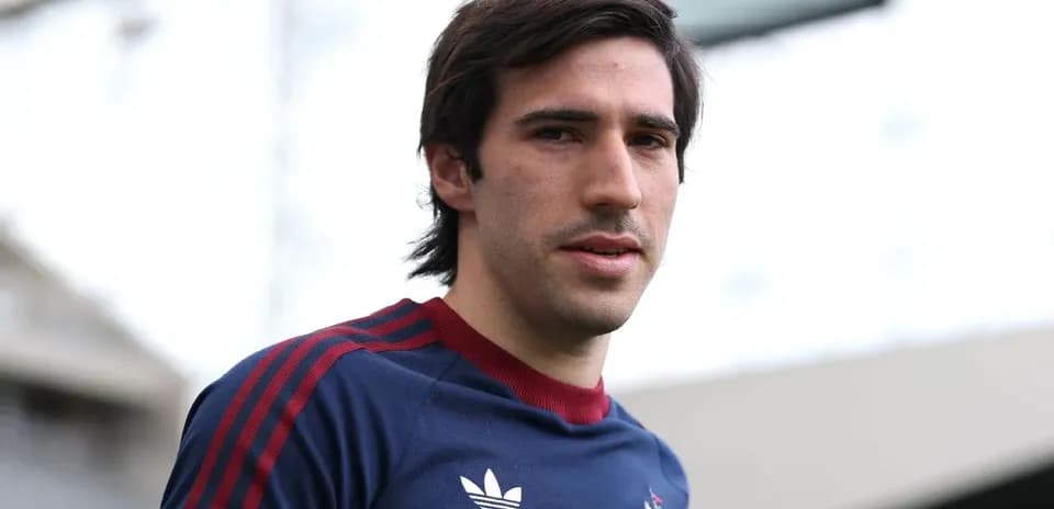 Football player posing in team training kit