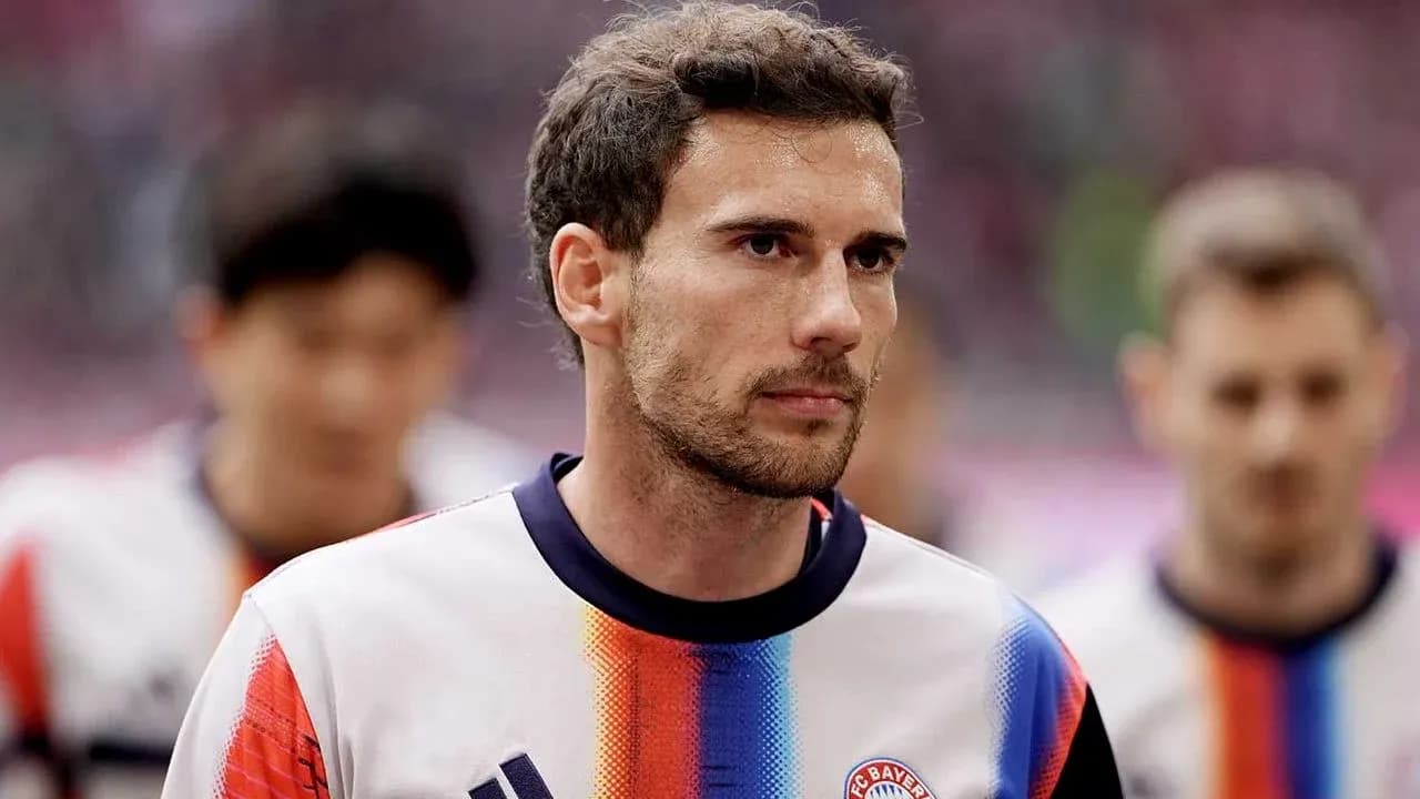 Player in Bayern Munich jersey walking onto the field