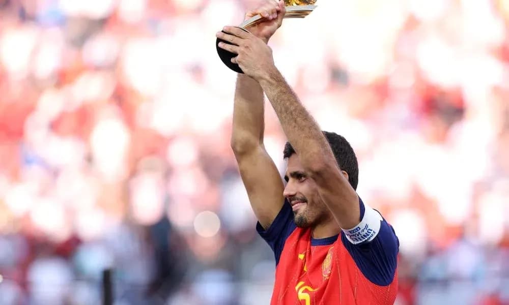 Player holding trophy aloft in celebration
