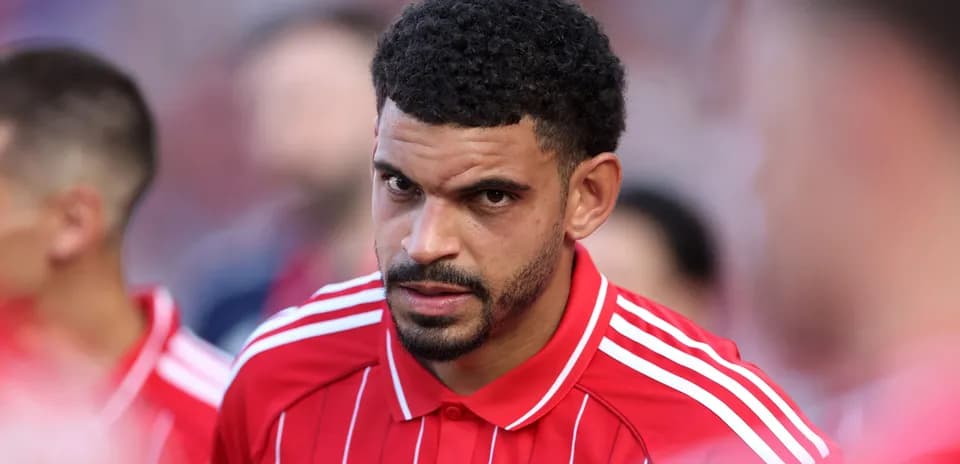 Player in red jersey preparing for match
