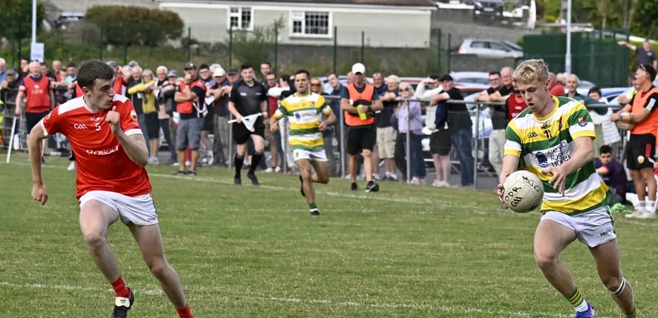 Player in yellow and green receiving ball during match