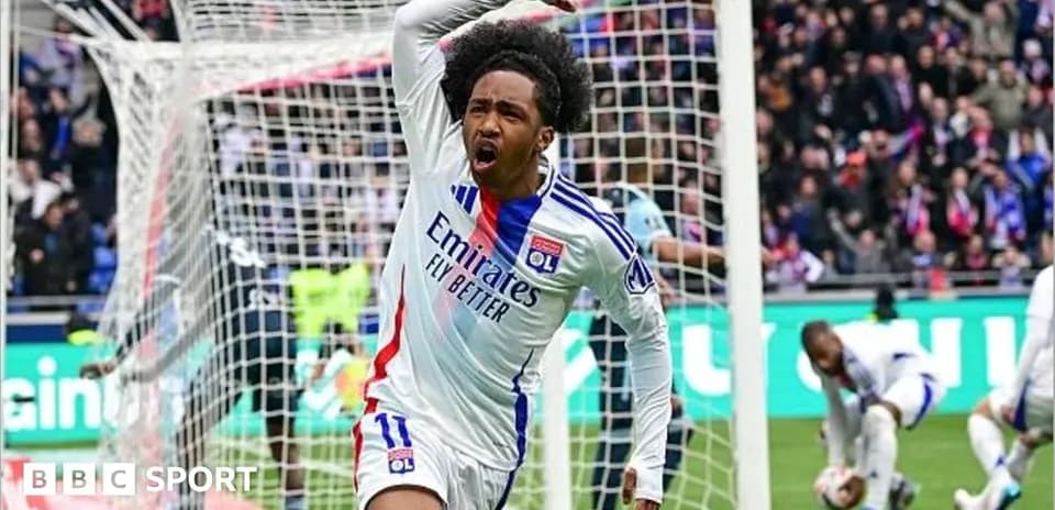 Player celebrating a goal in Lyon's stadium