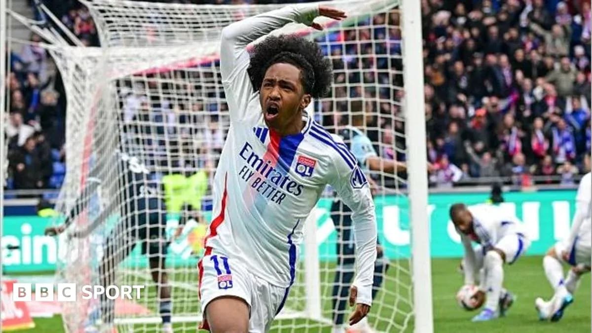 Player celebrating a goal in Lyon's stadium