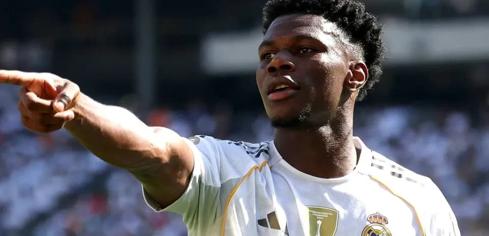 Player pointing during match in white jersey