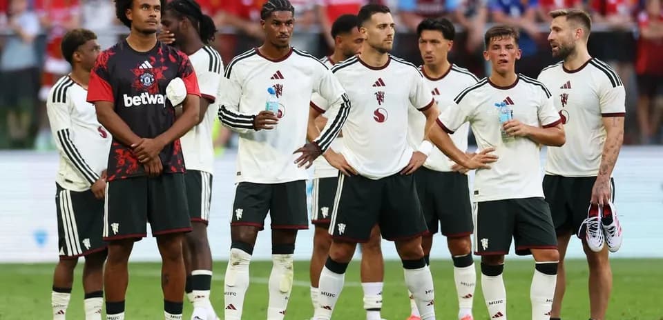 Players lined up during a match, wearing team uniforms