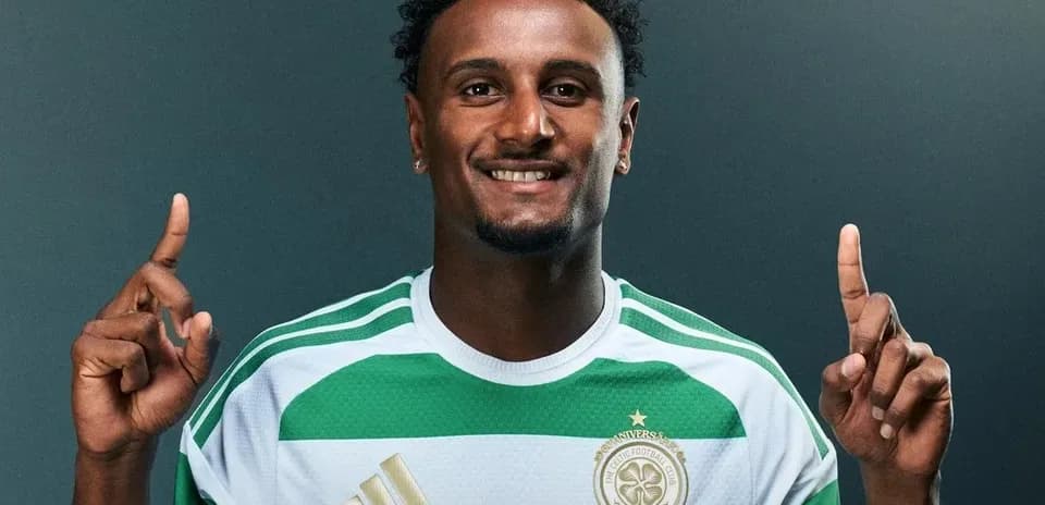 Player in Celtic kit posing with one finger raised