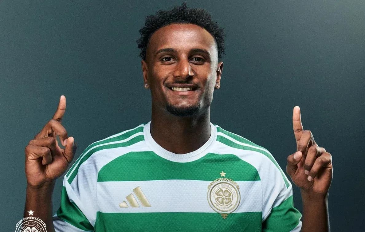 Player in Celtic kit posing with one finger raised