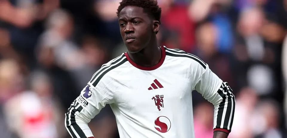 Player in white kit during football match