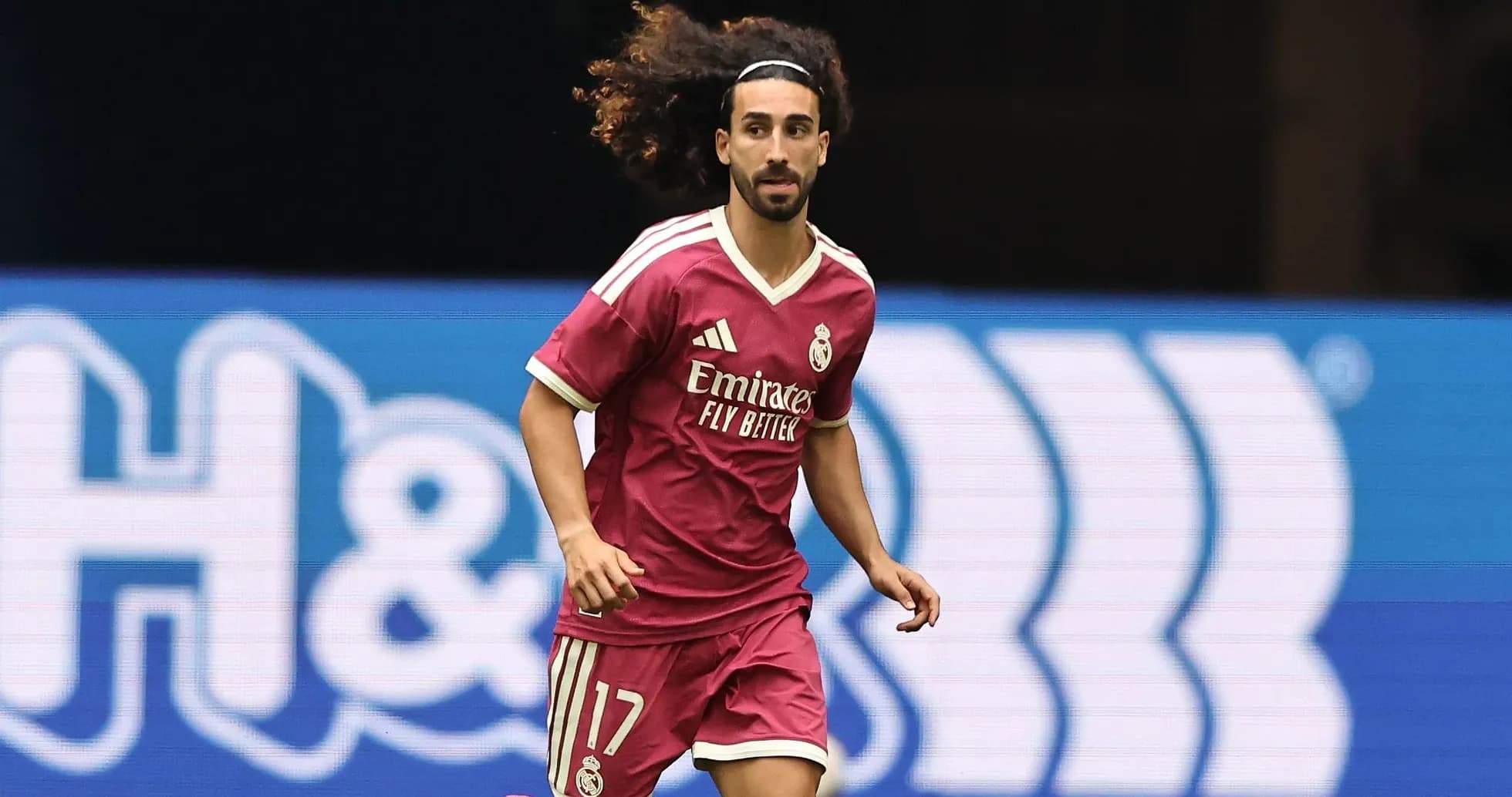 Player in pink jersey running on the field
