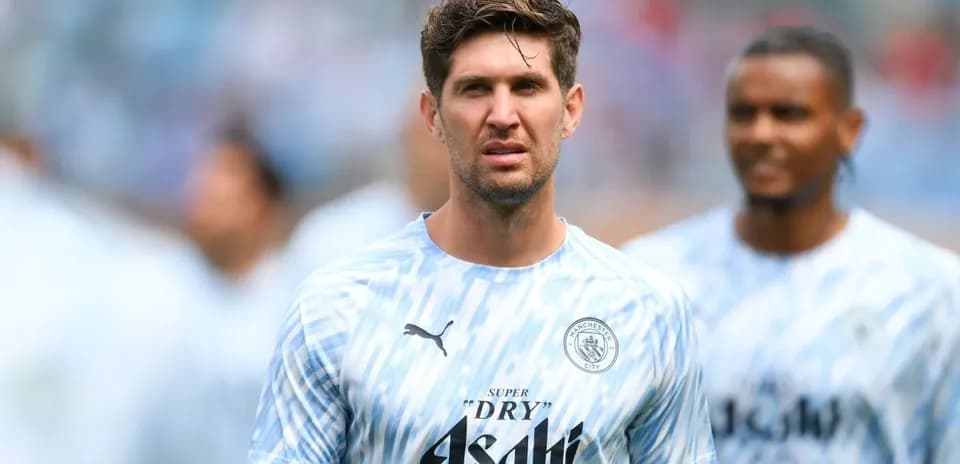 Player wearing Manchester City training kit on pitch